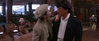 Movie still from “Twin Dragons” (1992), directed by Ringo Lam – A man and a woman are kissing each other in a restaurant; Medium shot, Over the shoulder angle