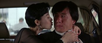 Movie still from “Twin Dragons” (1992), directed by Ringo Lam – A man and a woman are kissing in a car; Close Up shot, Over the shoulder angle
