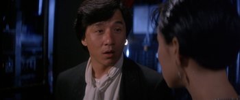 Movie still from “Twin Dragons” (1992), directed by Ringo Lam – A man in a black jacket and a woman in a white shirt; Close Up shot, Over the shoulder angle