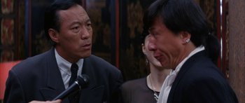 Movie still from “Twin Dragons” (1992), directed by Ringo Lam – Two men and a woman in a room; Close Up shot, Over the shoulder angle