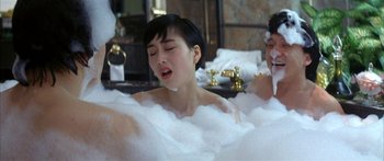 Movie still from “Twin Dragons” (1992), directed by Ringo Lam – Two people in a bath tub with foam on their faces; Medium shot, High angle