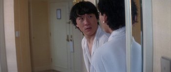 Movie still from “Twin Dragons” (1992), directed by Ringo Lam – A man in a white shirt looking at a woman in a white shirt; Close Up shot, Over the shoulder angle