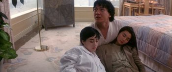 Movie still from “Twin Dragons” (1992), directed by Ringo Lam – A man and a woman sitting next to each other on the floor; Medium shot, High angle