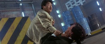 Movie still from “Twin Dragons” (1992), directed by Ringo Lam – Two men are fighting in a room; Medium shot, Over the shoulder angle