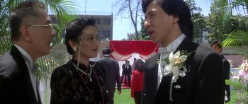 Movie still from “Twin Dragons” (1992), directed by Ringo Lam – A man and a woman in formal wear talking to each other; Close Up shot, Over the shoulder angle
