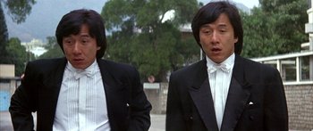 Movie still from “Twin Dragons” (1992), directed by Ringo Lam – Two men in tuxedos standing next to each other; Close Up shot, Low angle