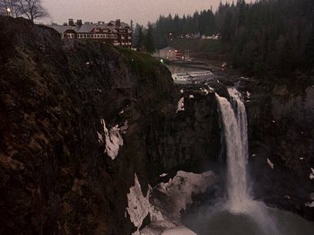 Movie still from “Twin Peaks” (1990), created by David Lynch – A view of a waterfall from the side of a cliff; Extreme Wide shot, High angle