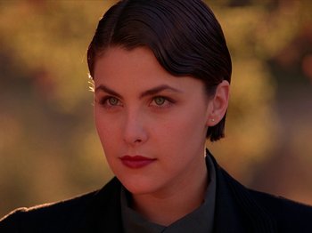 Movie still from “Twin Peaks” (1990), created by David Lynch – A person with short hair; Close Up shot, Low angle
