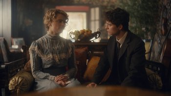 Movie still from “Anne with an E” (2017), created by Moira Walley-Beckett – A man and a woman sitting in a room; Medium shot, Over the shoulder angle