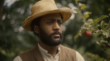 Movie still from “Anne with an E” (2017), created by Moira Walley-Beckett – A man wearing a straw hat and a vest; Close Up shot, Low angle
