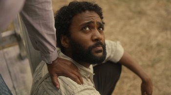 Movie still from “Anne with an E” (2017), created by Moira Walley-Beckett – A man with his arm around another mans shoulder; Close Up shot, High angle