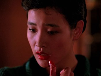 Movie still from “Twin Peaks” (1990), created by David Lynch – A young man with red lipstick on his mouth; Close Up shot, High angle