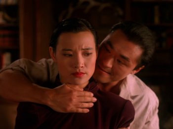 Movie still from “Twin Peaks” (1990), created by David Lynch – A man hugging a woman with her eyes closed; Close Up shot, Low angle