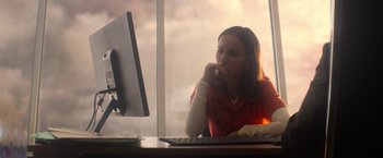 Movie still from “Annihilation” (2018), directed by Alex Garland – A woman sitting in front of a computer monitor; Medium shot, Over the shoulder angle