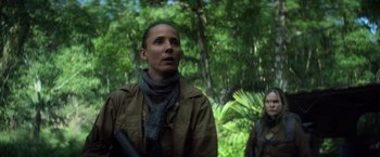 Movie still from “Annihilation” (2018), directed by Alex Garland – A woman in a brown jacket is looking up; Close Up shot, Low angle