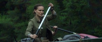 Movie still from “Annihilation” (2018), directed by Alex Garland – A woman rowing a boat in the water; Medium shot, Over the shoulder angle