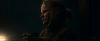 Movie still from “Annihilation” (2018), directed by Alex Garland – A woman with long blonde hair looking to the side; Close Up shot, Low angle