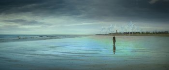 Movie still from “Annihilation” (2018), directed by Alex Garland – A person standing on a beach near the ocean; Extreme Wide shot, Over the shoulder angle