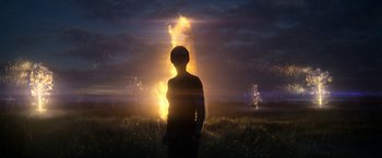 Movie still from “Annihilation” (2018), directed by Alex Garland – A man standing in front of a burning tree at night; Extreme Wide shot, Low angle