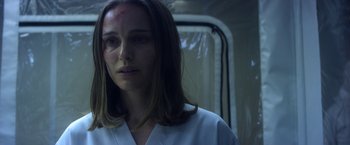 Movie still from “Annihilation” (2018), directed by Alex Garland – A person with a bruise on her face; Close Up shot, Over the shoulder angle