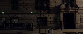 Movie still from “Anon” (2018), directed by Andrew Niccol – A street light on the side of a building at night; Extreme Wide shot, High angle