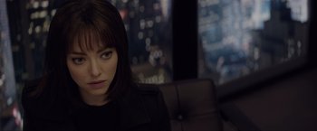 Movie still from “Anon” (2018), directed by Andrew Niccol – A person sitting in a chair; Close Up shot, Over the shoulder angle