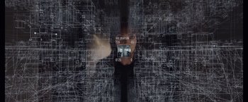 Movie still from “Anon” (2018), directed by Andrew Niccol – A woman is standing in front of a computer screen; Extreme Close Up shot, Over the shoulder angle