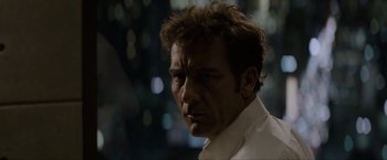 Movie still from “Anon” (2018), directed by Andrew Niccol – A person wearing a white shirt; Close Up shot, Low angle