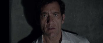 Movie still from “Anon” (2018), directed by Andrew Niccol – A person wearing a white shirt; Close Up shot, High angle