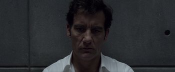 Movie still from “Anon” (2018), directed by Andrew Niccol – A person wearing a white shirt; Close Up shot, Low angle