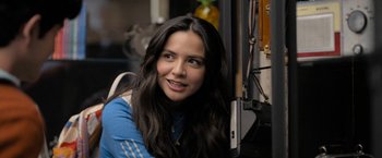 Movie still from “Anonymously Yours” (2021), directed by Maria Torres – A beautiful young lady sitting in front of a window; Close Up shot, Over the shoulder angle