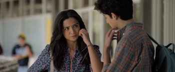 Movie still from “Anonymously Yours” (2021), directed by Maria Torres – A young woman looking at a young man; Close Up shot, Over the shoulder angle