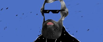 Movie still from “Anonymously Yours” (2021), directed by Maria Torres – A man with a beard wearing sunglasses and a leather jacket; Close Up shot, Overhead angle