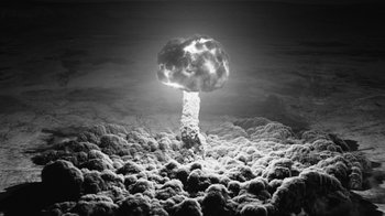Movie still from “Twin Peaks” (2017), directed by David Lynch – A mushroom cloud is shown in the sky; Extreme Wide shot, Overhead angle