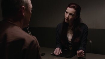 Movie still from “Twin Peaks” (2017), directed by David Lynch – A woman sitting at a table talking to a man; Medium shot, Over the shoulder angle