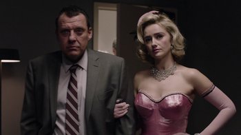 Movie still from “Twin Peaks” (2017), directed by David Lynch – A man and a woman standing next to each other in a room; Medium shot, Low angle