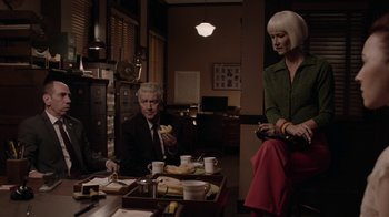 Movie still from “Twin Peaks” (2017), directed by David Lynch – A man and a woman sitting at a dinner table; Medium shot, Over the shoulder angle