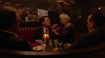 Movie still from “Twin Peaks” (2017), directed by David Lynch – A man and a woman sitting at a table in a restaurant; Medium shot, High angle