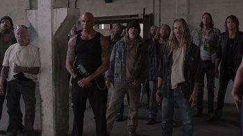 Movie still from “Twin Peaks” (2017), directed by David Lynch – A group of men standing next to each other in a building; Wide shot, High angle