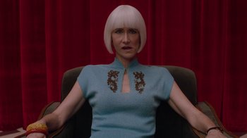 Movie still from “Twin Peaks” (2017), directed by David Lynch – A woman sitting in a chair wearing a blue dress; Close Up shot, Low angle