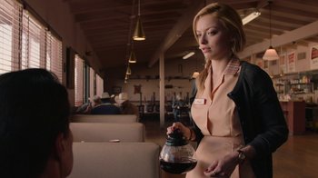 Movie still from “Twin Peaks” (2017), directed by David Lynch – A woman holding a coffee pot in her hand; Medium shot, Over the shoulder angle