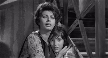Movie still from “Two Women” (1960), directed by Vittorio De Sica – Two young women posing for a picture in black - and - white; Close Up shot, Low angle