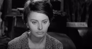 Movie still from “Two Women” (1960), directed by Vittorio De Sica – A black and white photo of a woman looking at the camera; Close Up shot, High angle