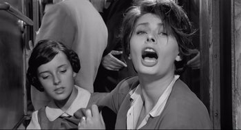 Movie still from “Two Women” (1960), directed by Vittorio De Sica – A woman with her mouth wide open in an old photo; Close Up shot, Low angle