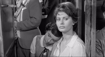 Movie still from “Two Women” (1960), directed by Vittorio De Sica – A woman leaning on a man's shoulder in a black and white photo; Close Up shot, High angle