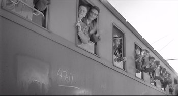 Movie still from “Two Women” (1960), directed by Vittorio De Sica – A black - and - white photo of people looking out of a train window; Medium shot, Low angle