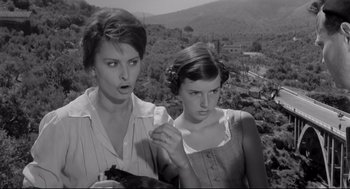 Movie still from “Two Women” (1960), directed by Vittorio De Sica – A woman and a young girl standing next to each other on top of a hill; Medium shot, Low angle