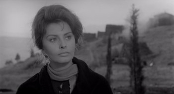 Movie still from “Two Women” (1960), directed by Vittorio De Sica – A black - and - white photo of a woman in a jacket; Close Up shot, Low angle