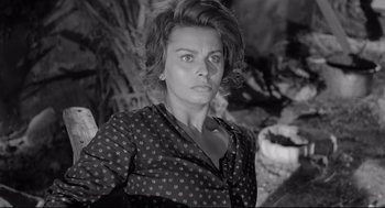 Movie still from “Two Women” (1960), directed by Vittorio De Sica – A black and white photo of a woman with short hair; Close Up shot, High angle