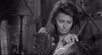 Movie still from “Two Women” (1960), directed by Vittorio De Sica – A black - and - white photo of a woman crying; Close Up shot, High angle